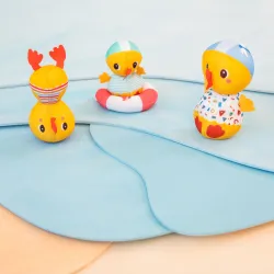 3 bath ducks learning to swim