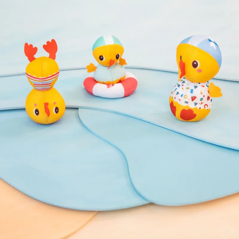 3 bath ducks learning to swim