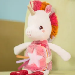 Libro de tela y peluche de Lena la Unicornio fosforescente